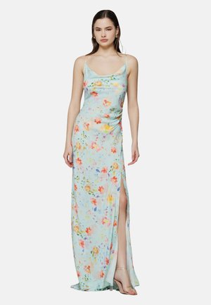 Abito maxi floreale in tessuto azzurro chiaro con motivi di fiori multicolori, spalline sottili e uno spacco laterale. Tessuto morbido.