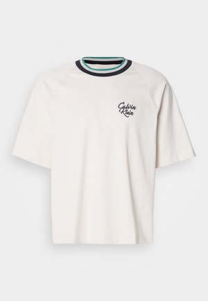 Short-sleeve, cream-colored T-shirt with a ribbed multi-color crew neck and "Calvin Klein" logo embroidered on the left chest.