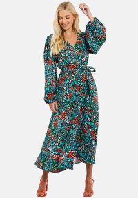 Maxikleid mit langen Puffärmeln in einem lebhaften mehrfarbigen Blumenmuster, mit Wickeldesign und gebundenem Taillendetail.