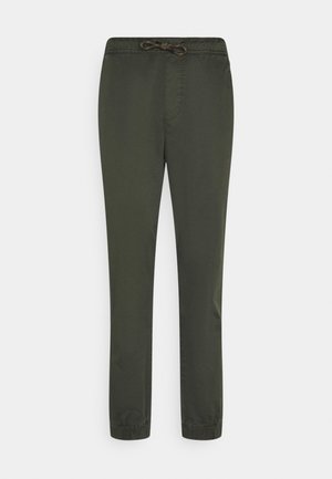 Olive green, lightweight trousers with an elastic waistband, drawstring, and tapered legs. Features side pockets and smooth texture.