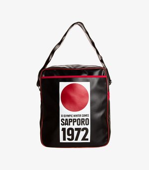 Black synthetic bag featuring red accents, a large white label with a red circle, "SAPPORO," and "XI OLYMPIC WINTER GAMES 1972" text.