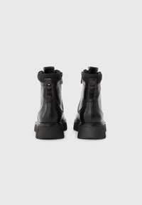 Marco Tozzi Bottines compensées - black comb
