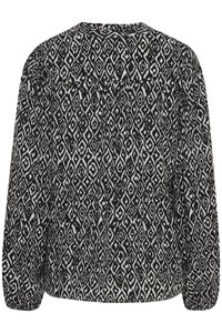 Blusa a maniche lunghe in bianco e nero con motivo a diamante, realizzata in tessuto morbido e con maniche arricciate, adatta per un abbigliamento casual.