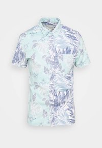 Koszula z krótkim rękawem o podzielonym wzorze; z jednej strony jasnoniebieski kwiatowy nadruk, z drugiej granatowe tropikalne liście na białym tle.