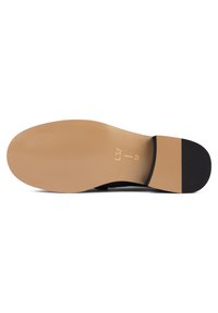 Semelle de chaussure noire avec une base en caoutchouc beige clair. Présente une texture de surface nervurée et un petit accent noir au talon. Taille indiquée comme 37.