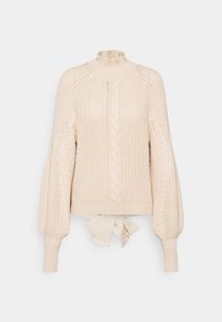 Maglione lavorato a maglia in beige chiaro con collo alto, motivi a treccia, maniche a sbuffo e dettaglio in vita con fiocco. Tessuto texturizzato su tutta la superficie.