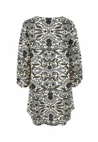 Blomsterprintet tunika i cremefarvet med sort og blå design. Lange ærmer, rund halsudskæring og en afslappet pasform med en let buet kant.