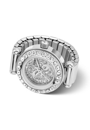 Montre-bracelet pour femme en argent avec bracelet métallique extensible, lunette sertie de cristaux, cadran scintillant et logo décoratif sur le cadran.