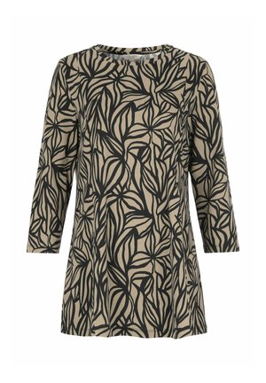 Tunique beige à manches longues avec motif abstrait de feuilles noires et col rond.