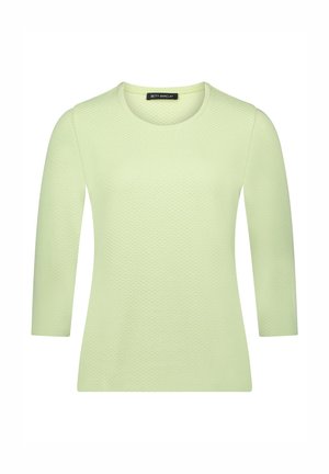 Haut à manches longues vert clair en tissu texturé, avec un col rond et un motif subtil, de coupe droite.