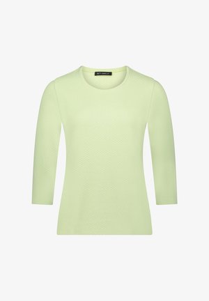 Haut à manches longues vert clair en tissu texturé, avec un col rond et un motif subtil, de coupe droite.