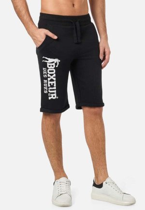 Shorts en coton noir avec un cordon de serrage à la taille, poches latérales et un imprimé graphique blanc. Ourlet roulé au niveau du genou avec une coupe décontractée.