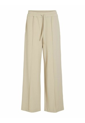 Pantalons larges beiges en tissu doux, dotés d'une taille élastique avec cordon de serrage et de deux plis à l'avant.