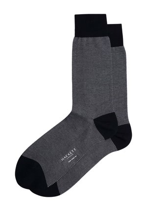 Schwarze Socken mit einem strukturierten grauen Punktmuster, gerippten Bündchen und verstärkten Zehen- und Fersenbereichen für Langlebigkeit.