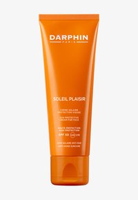 Crème solaire DARPHIN Soleil Plaisir dans un tube orange vif, avec un texte blanc indiquant SPF 50 et des bienfaits anti-âge.