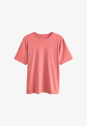 Korallivärvi lühikeste varrukatega T-särk, mis on valmistatud pehmest puuvillast, omab ümarat kaelaauku ja vabalt istuvat lõiget. Sile tekstuur ja minimaalsete disainielementidega.