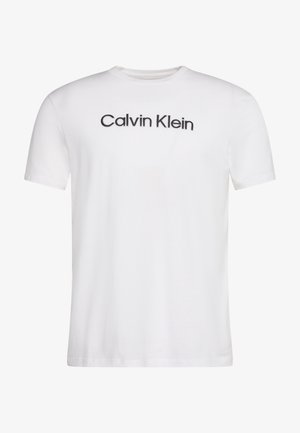 Biele krátke rukávy s guľatým výstrihom tričko s čiernym textom "Calvin Klein" vycentrovaným na hrudi.
