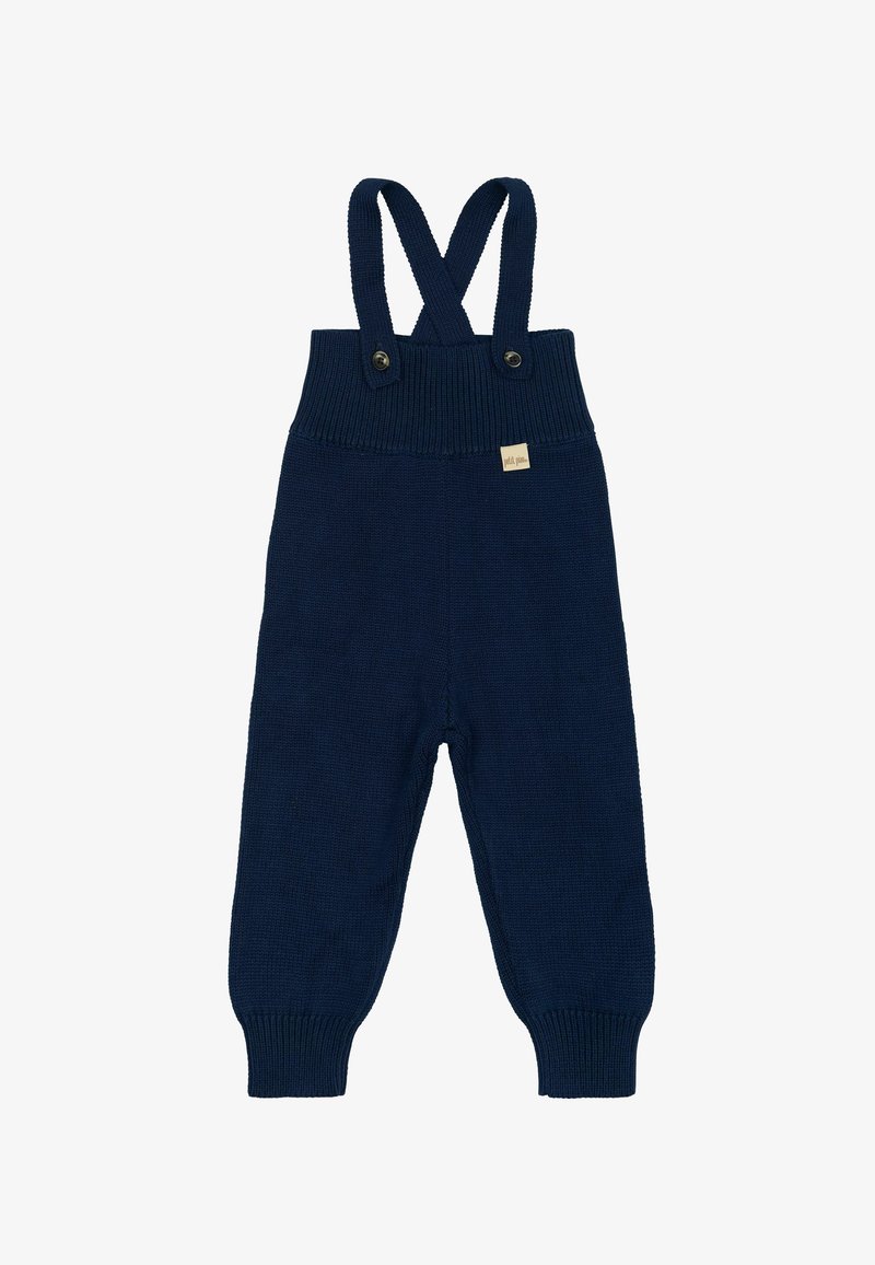 Salopette in maglia blu navy con bretelle incrociabili regolabili e due bottoni in vita. Include un piccolo badge etichettato sul davanti.