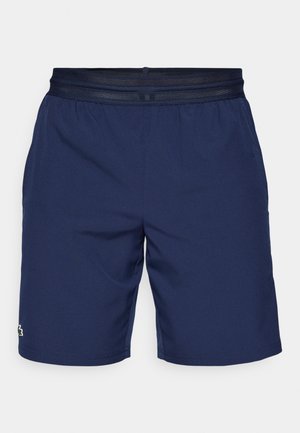 Marineblauwe mannen sportshorts met een elastische mesh tailleband en klein geborduurd logo op de linkerzoom.