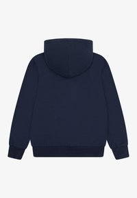 Sudadera azul marino hecha de una suave combinación de algodón, con una gran capucha, mangas largas y puños y dobladillo acanalados. Vista trasera.