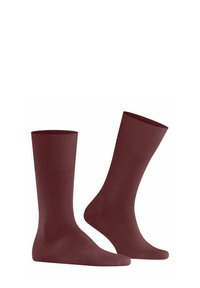 Chaussettes bordeaux avec un poignet côtelé et une texture lisse, présentant un design classique de hauteur de cheville, adaptées à un usage quotidien.