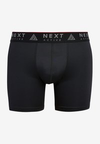 Boxer shorts attivi neri con una ampia cintura elastica e il logo "NEXT ACTIVE" in grigio. Realizzati in un materiale liscio e elasticizzato.