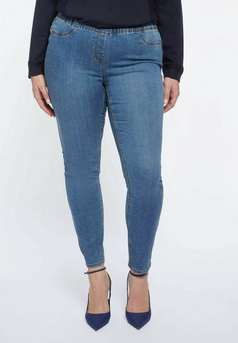 Blå denimleggings med en skräddarsydd design, som har en stretchy midja, diskreta framfickor och en slät textur.