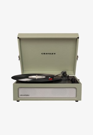 Crosley turntable in light green with a textured exterior, black playing surface, and a visible black vinyl record. Metal hardware is featured.