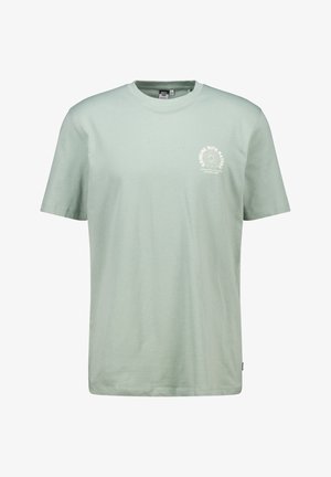 T-shirt in cotone verde chiaro con maniche corte, scollatura rotonda e stampa grafica bianca circolare nella zona sinistra del petto.