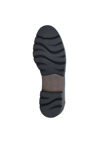Suola di scarpa in gomma nera con scanalature profonde e motivi ondulati; area imbottita di un marrone chiaro al centro per un comfort aggiuntivo.