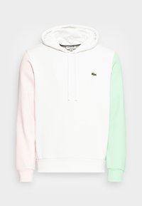 Felpa con cappuccio in bianco, rosa e verde menta. Presenta lacci, polsini a costine e un piccolo logo Lacoste sul petto. Tessuto morbido.