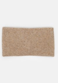 Bandeau en tricot en tissu beige doux, forme rectangulaire, surface texturée avec un motif subtil, adapté pour les accessoires de tête.