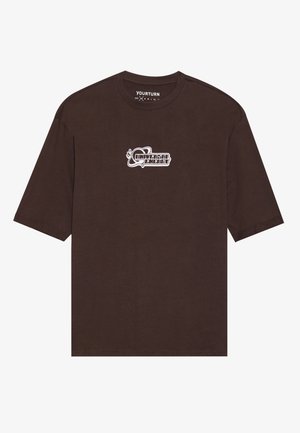 Brown short-sleeve t-shirt made of cotton. Features a white graphic text "Universal Energy" on the front. Simple crew neck design.