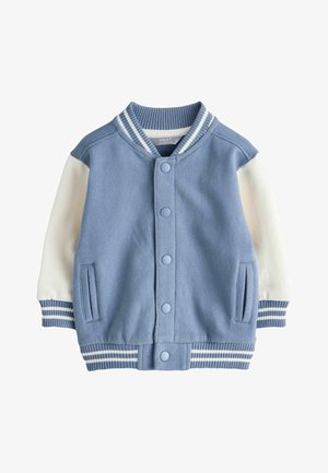 Kék egyetemista dzseki fehér ujjakkal, bordázott nyakkal és csíkos mandzsettákkal. Gombos záródással és oldalzsebekkel lágy anyagból.