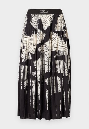 Fellő szoknya fekete-fehér pálma levél mintával, elasztikus derékkal és lágy anyaggal. Kényelmes, laza szabású.