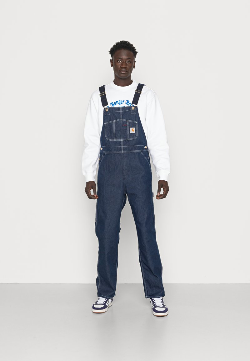 Carhartt WIP BIB OVERALL - Laisvo kirpimo džinsai - blue one wash