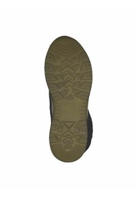 Suela de zapato con un patrón de textura en relieve con surcos en forma de zigzag, en un color oscuro con un material de goma beige contrastante para mayor agarre y durabilidad.