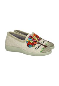 Zapatillas de fieltro en beige claro con bordados florales coloridos en la parte frontal. Forma redondeada con forro suave y suela de goma texturizada.