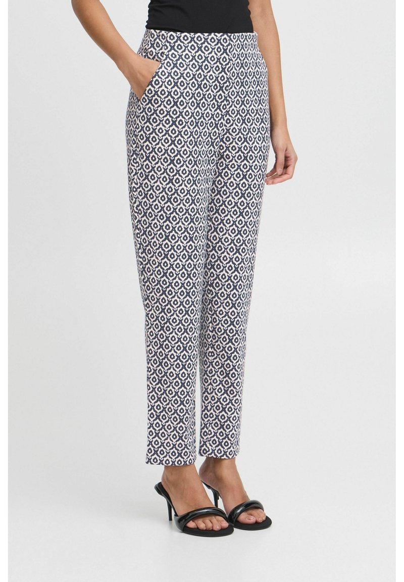 Patterned trousers in navy and white, featuring a geometric design, straight legs, two side pockets, and a fitted waistband.