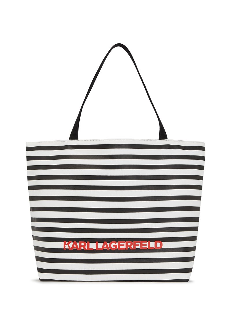 Tote-Bag aus robustem Stoff mit schwarz-weißen horizontalen Streifen. Mit schwarzen Griffen und "KARL LAGERFELD" in fettem roten Schriftzug.