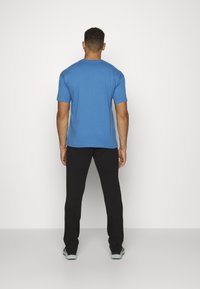 Champion Träningsbyxor - black