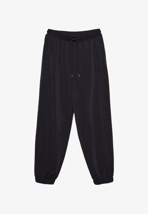 Černé joggingové kalhoty vyrobené z měkké tkaniny, s elastickým pasem a stahovací šňůrkou, zúženými nohavicemi a manžetami na kotnících.