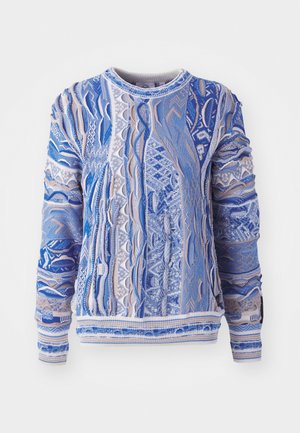 Pull en tricot bleu et beige, présentant des motifs texturés et des motifs. Poignets et ourlet côtelés ; col rond. Matériau léger.