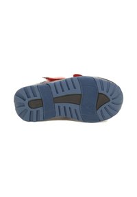 La suola della scarpa presenta una base in gomma blu testurizzata con accenti neri, scanalature per la trazione e una forma arrotondata per il comfort.