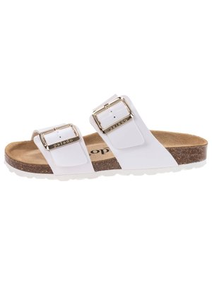 White slide sandals with two adjustable straps, gold buckle accents, cork footbed, and textured rubber sole. Casual and comfortable design.