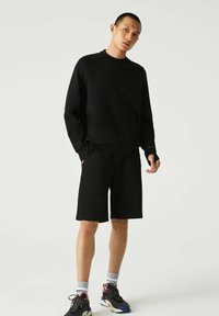 Lacoste - Sweater - noir Miniatuurafbeelding 1