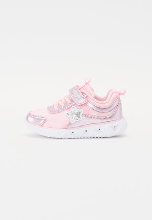 Pink athletic shoe with a shiny silver star accent, velcro strap, and textured white sole featuring a wavy pattern and small silver studs.