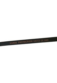 Black sunglasses arm featuring embossed text: "UV400 PROTECTION CAT.3 CE 069". Smooth finish, minimalist design, no additional accents.
