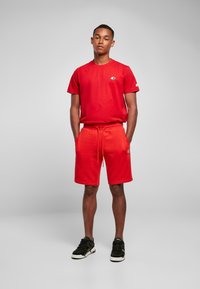 Starter ESSENTIAL - Tepláky - cityred