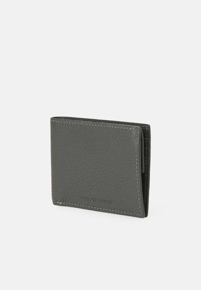 Gray leather wallet with a textured finish, bi-fold design, white stitching, and embossed branding. Compact and sleek, with card slots inside.